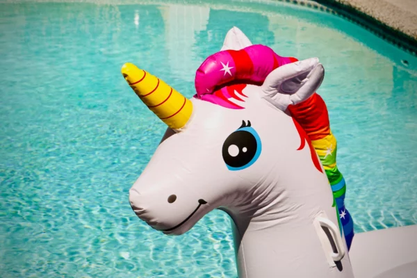unicorn pool floaty close up. basically gay, full of rainbows and cuteness