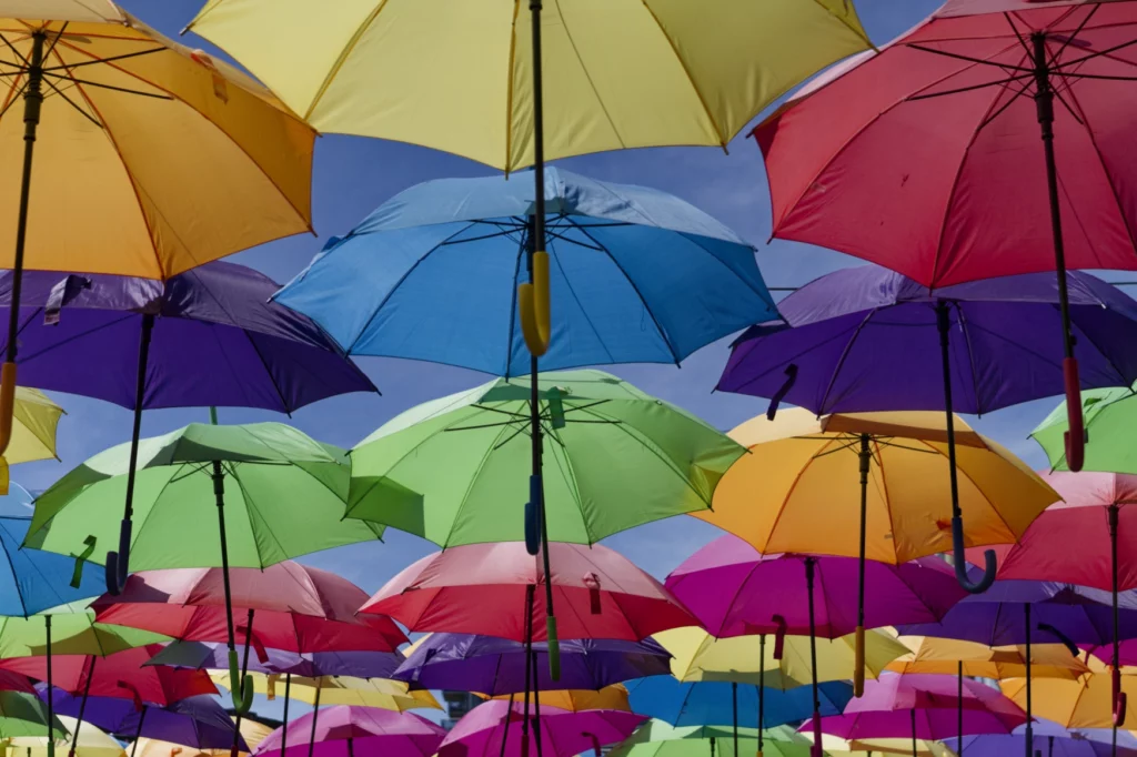 rainbow assortment of parasols floating in midair